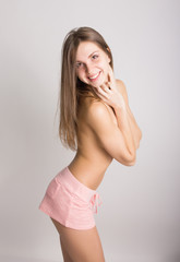 sexy backside of a young woman wearing pink shorts