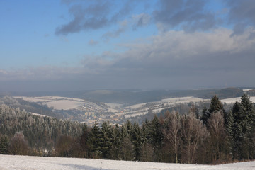 Winter landscape, small village, forest and meadow