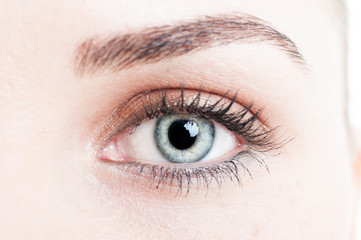 Close-up with green eye of woman model