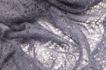 background of openwork knitted fabric - obrazy, fototapety, plakaty