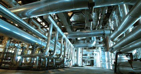 Steel pipelines and valves in blue tones