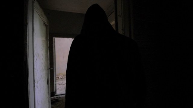 Slow motion of a drunken bum walking in an abandoned house