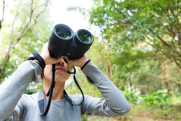 Young woman use of the binocular