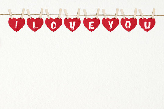 I love you words on red heart shape fabric background