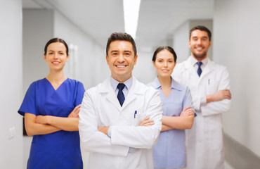 happy group of medics or doctors at hospital