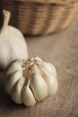 heap garlic on wood background