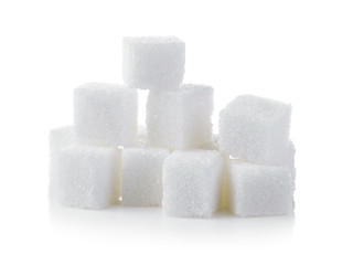 Cubes of sugar on white background