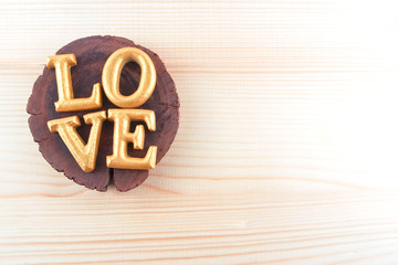 wood gold letter word love on wood background