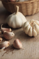 heap garlic on wood background
