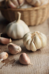 heap garlic on wood background