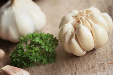 heap garlic on wood background