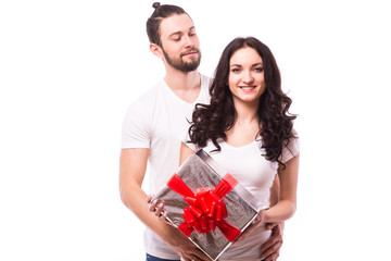 Valentine gift. Happy young couple with Valentine's Day present isolated on a white background....