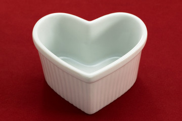 heart-shaped cocotte on the red background