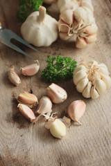 heap garlic on wood background