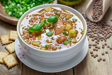 Homemade soup with lentils and sausages