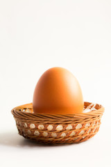 egg in basket wicker on white background,Duck eggs in baskets .