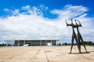 Dois Candangos Monument and Planalto Palace in Brasilia, capital of Brazil.