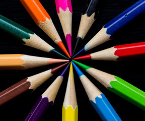 Fototapeta premium Color pencils on black background