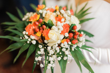 Bride holding a bouquet of flowers, wedding bouquet