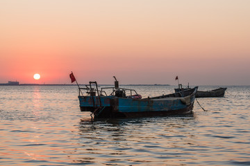 old fishing boat at sunset time -yantai,china