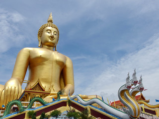 Huge gold buddha statue at temple in Thailand