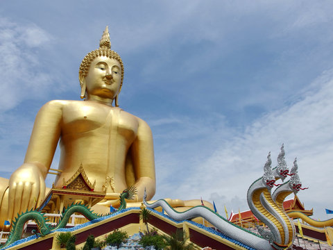 Huge gold buddha statue at temple in Thailand