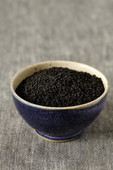Fototapeta na wymiar Nigella sativa (Black cumin) on ceramic bowl