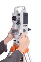hand working with survey equipment theodolite