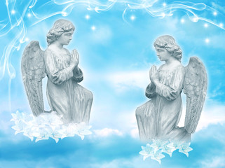 two praying angels with starry sky