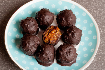 homemade raw chocolate candy with nuts, figs and citrus, truffle