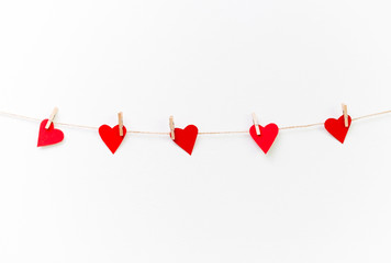 Red hearts hanging on clothesline