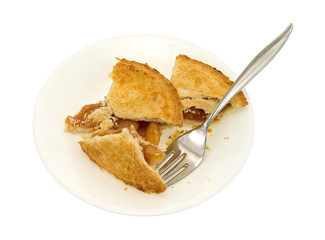 Small apple pie pieces on plate with fork