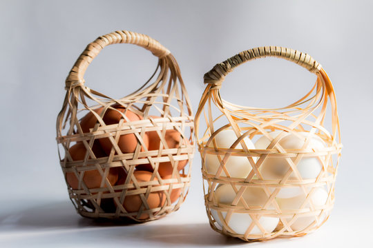 egg in basket wicker on white background,Duck eggs in baskets .