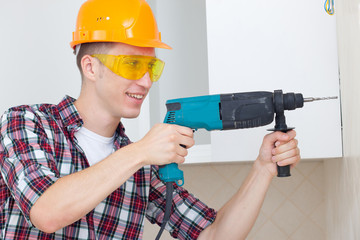 smiling worker with rock-drill
