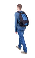 Naklejka premium back view of walking man with backpack.