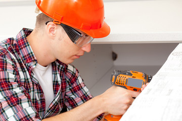 repairman with electric drill