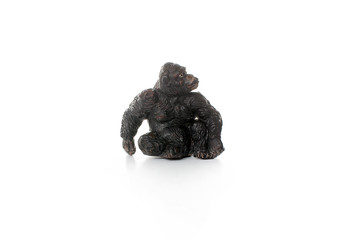 toy gorilla. plastic miniature figurine gorilla isolated on white background