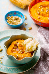 carrot dip with a flat cake.
