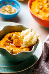 carrot dip with a flat cake.