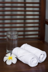 Spa composition wipes a glass of water and flowers