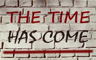 Wall with graffiti that says "The time has come" (abstract backg