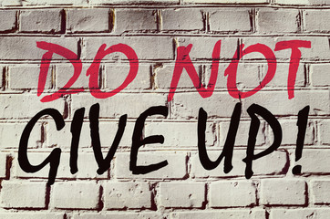 Wall with graffiti that says "Do not give up" (abstract backgrou