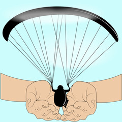 the image of a man flying on a paraglider in the hands