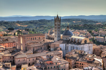 Fototapeta na wymiar View over Siena from the Torre del Mangia on Piazza del Campo looking at the Siena Cathedral HDR