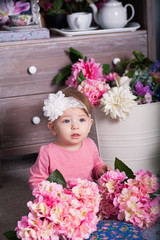 Adorable little girl in dress, crown of roses