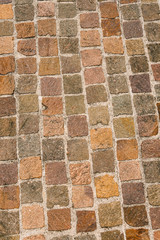 Fototapeta premium Porphyry Stone Floor - Sanpietrini or sampietrini / Multi colored blocks of porphyry (sanpietrini), typical urban paving in Italy