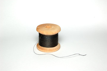 A small coil of thin black thread.