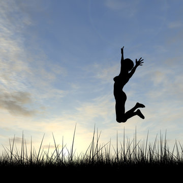 Conceptual young woman silhouette jumping happy on grass at sunset