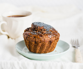 Handmade chocolate muffins with carob, honey, raisins and poppy