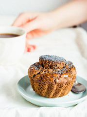 Handmade chocolate muffins with carob, honey, raisins and poppy